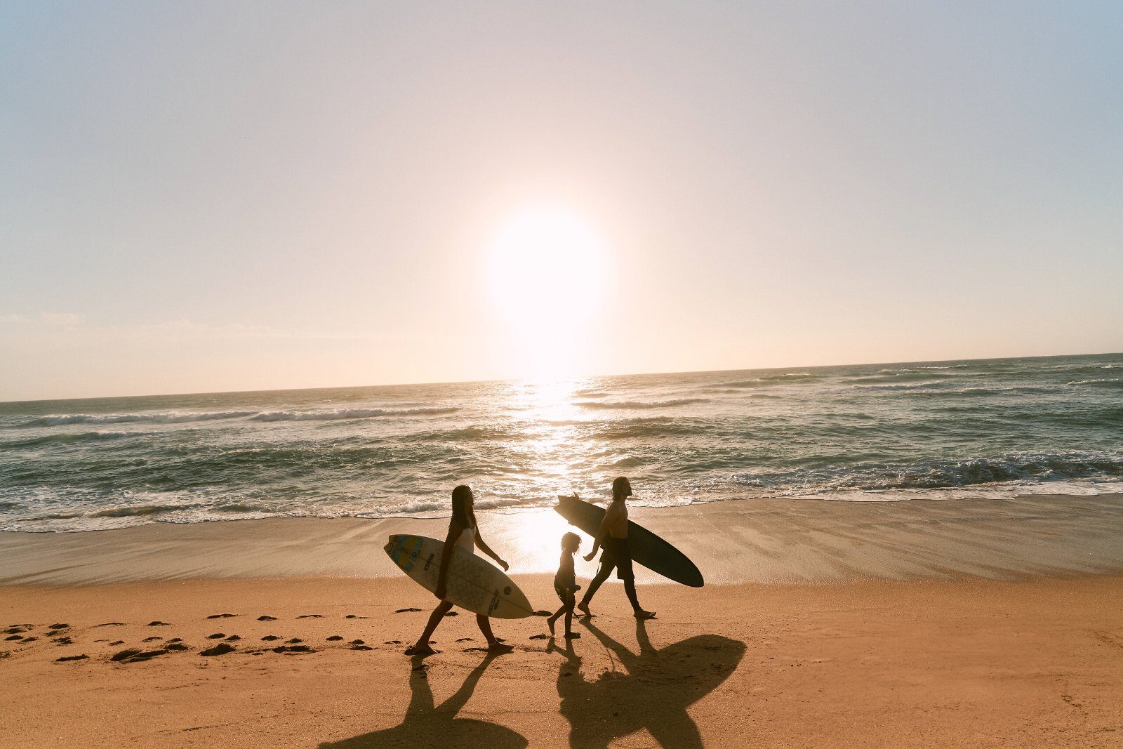 Surfers at sunset on the KwaZulu-Natal coast