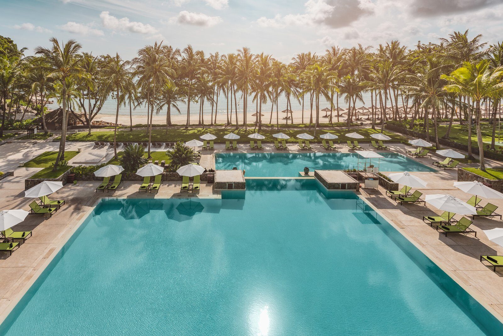 Palm-lined pool at Club Med Bintan Island