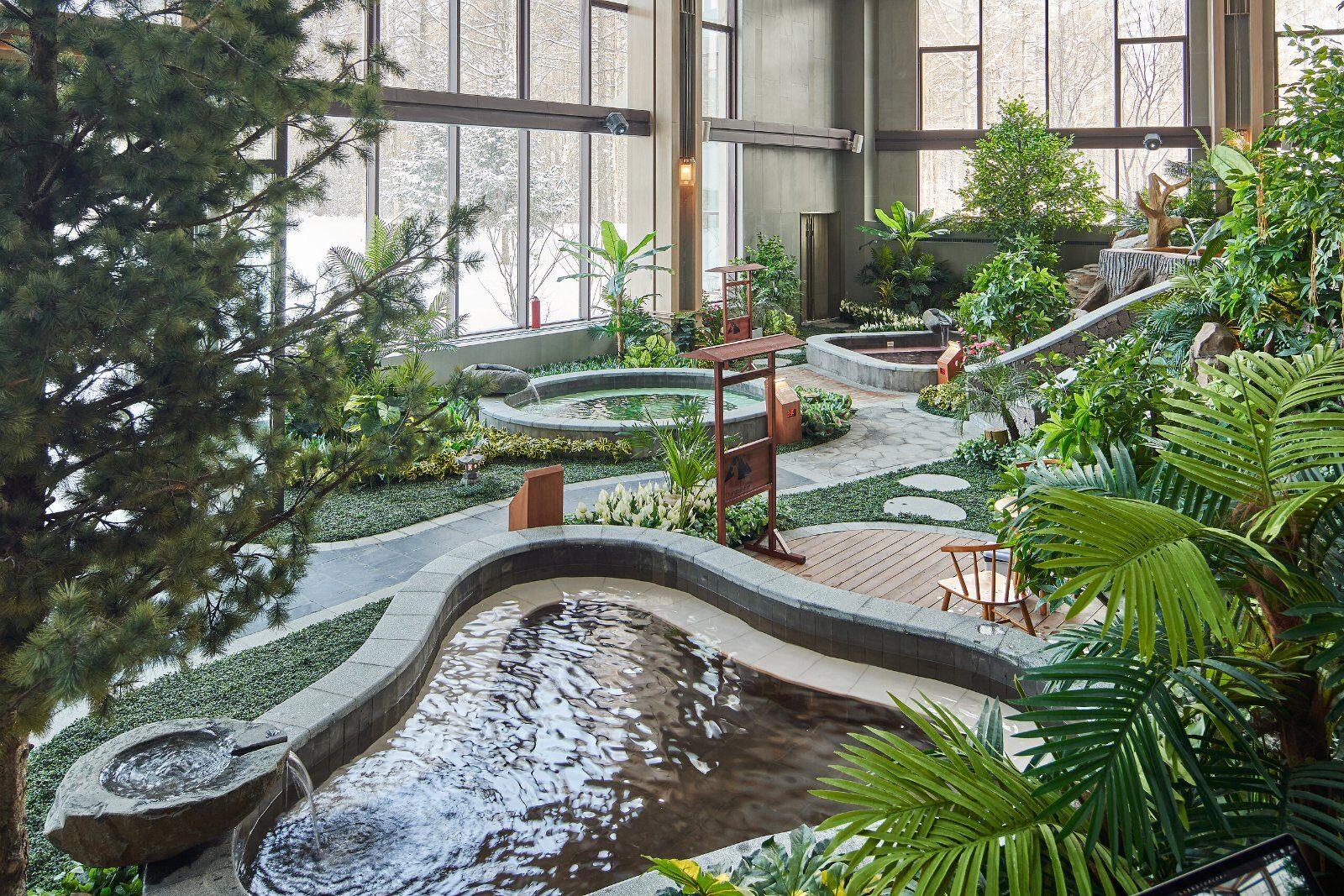 Outdoor pool surrounded by snow at Club Med Changbaishan