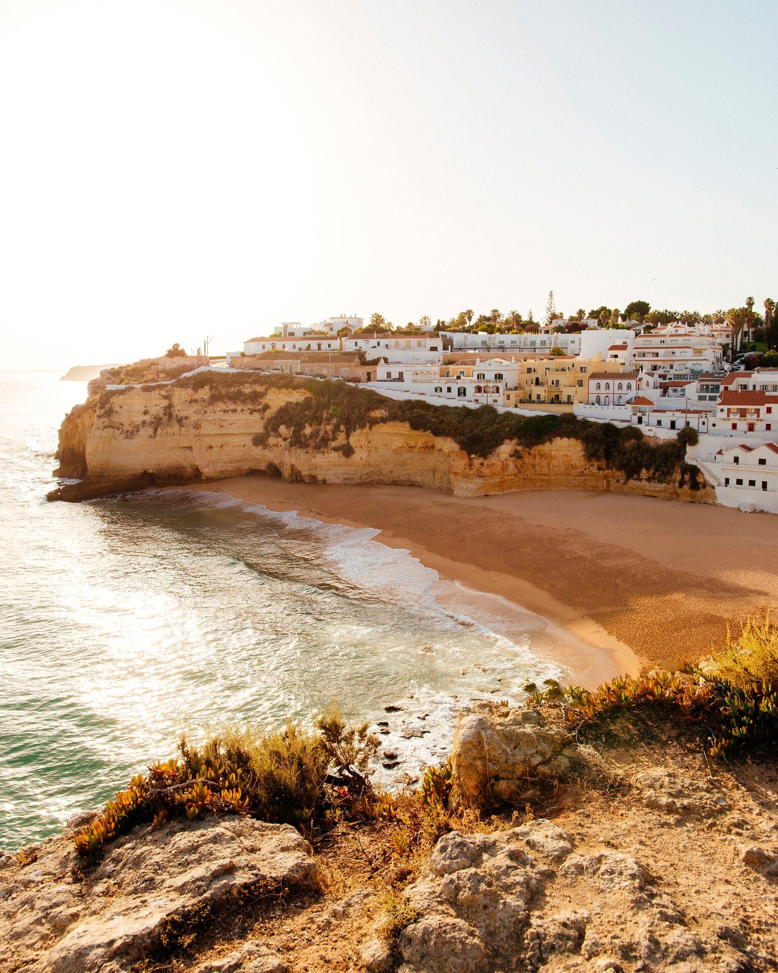 Golden cliffs and white houses on the Algarve coast Golden cliffs and white houses on the Algarve coast