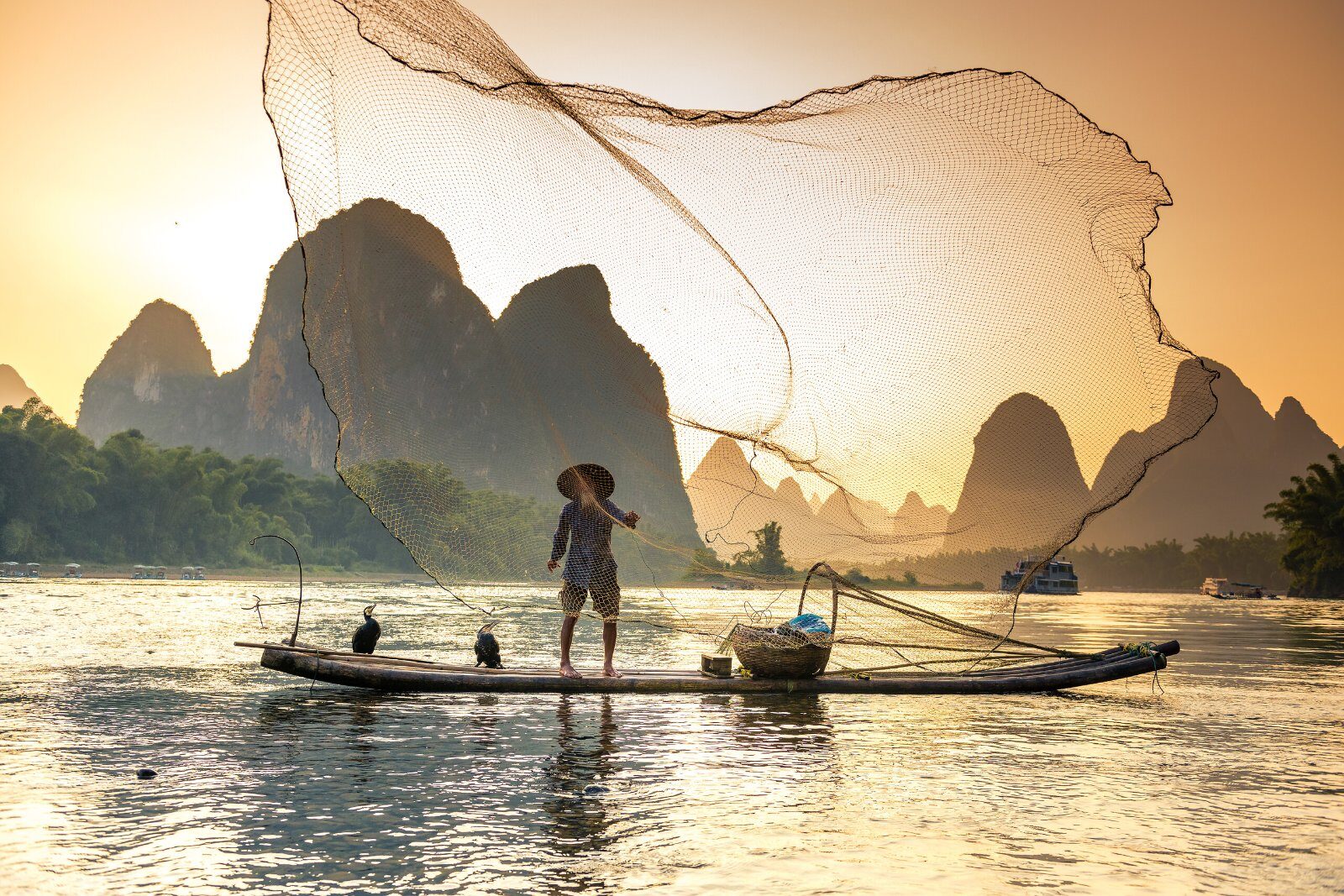 Fisherman at sunset on the Li River near Guilin