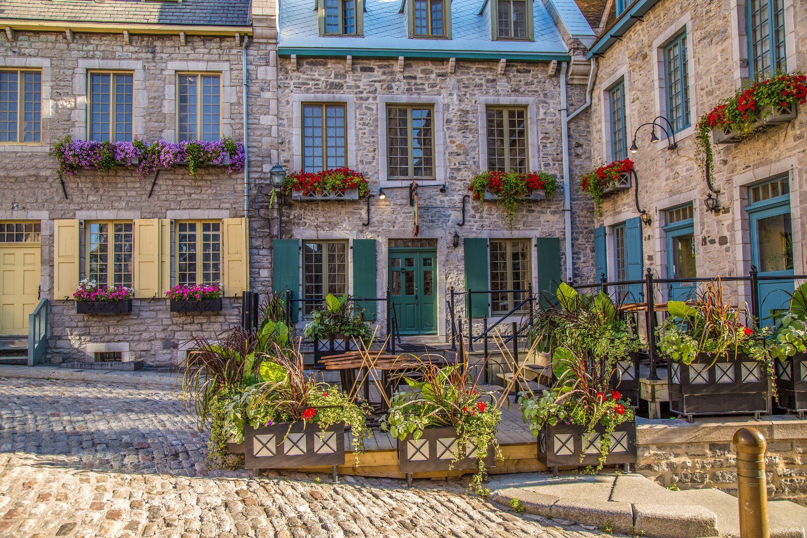 Flower-decked facades on an Old Quebec street