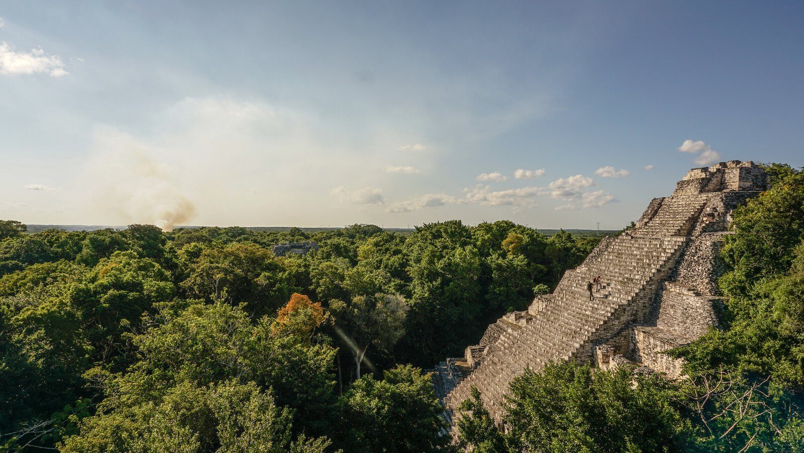 Mayan pyramid rising above the Yucatán jungle