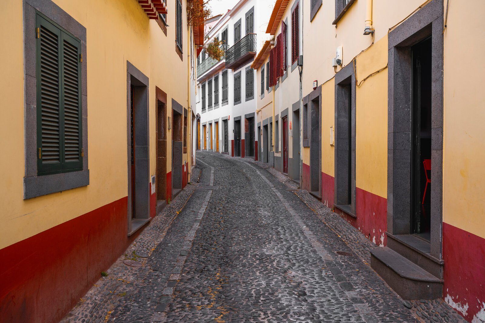 Cobbled lane with colourful facades in Funchal