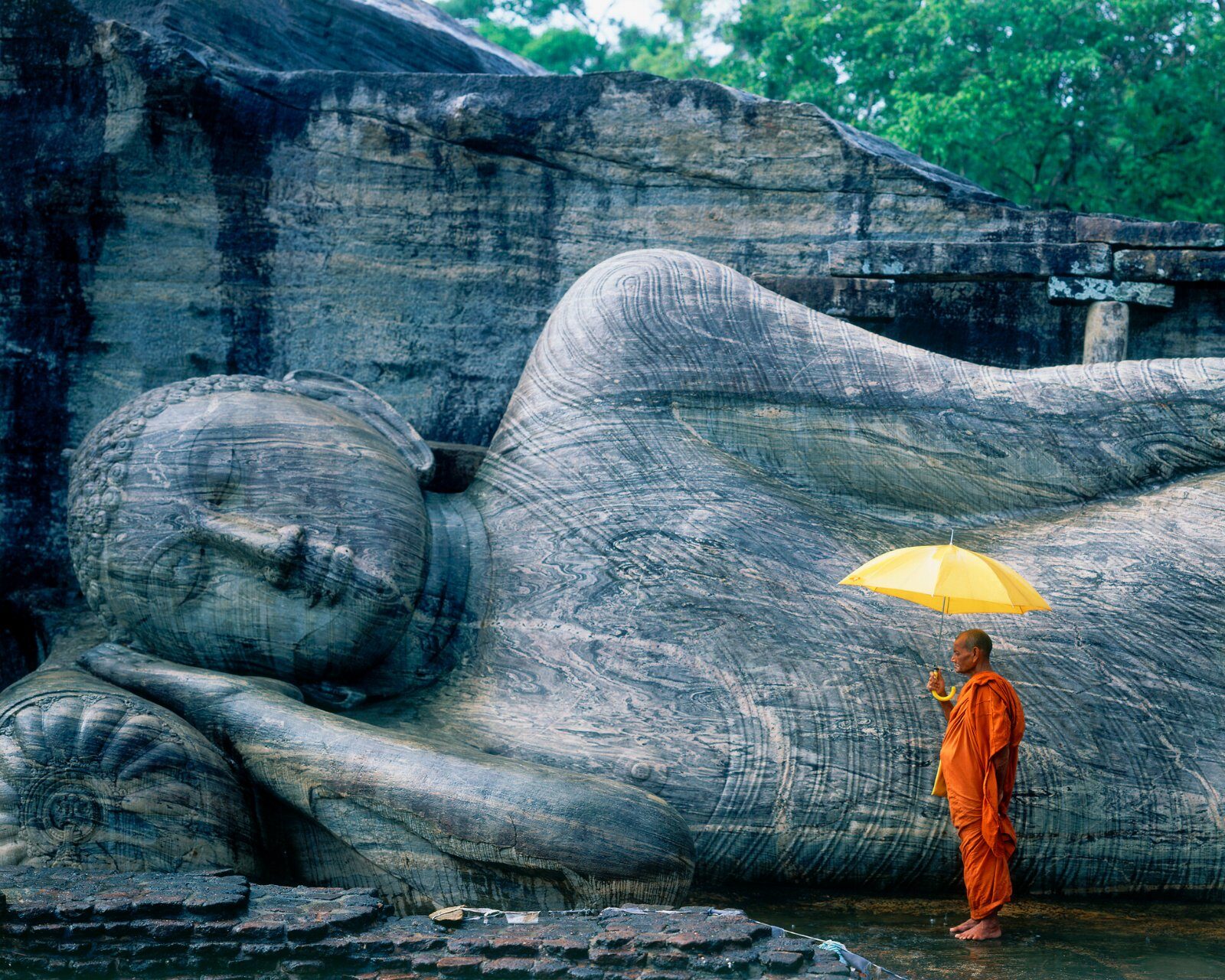 Reclining Buddha carved in stone in Sri Lanka