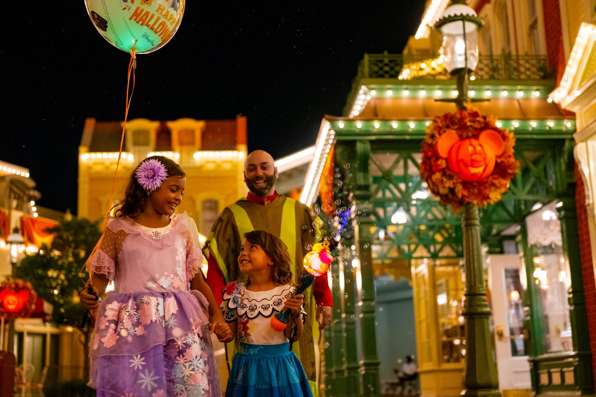 A family in costume on Main Street, U.S.A. during Mickey’s Not-So-Scary Halloween Party at Magic Kingdom