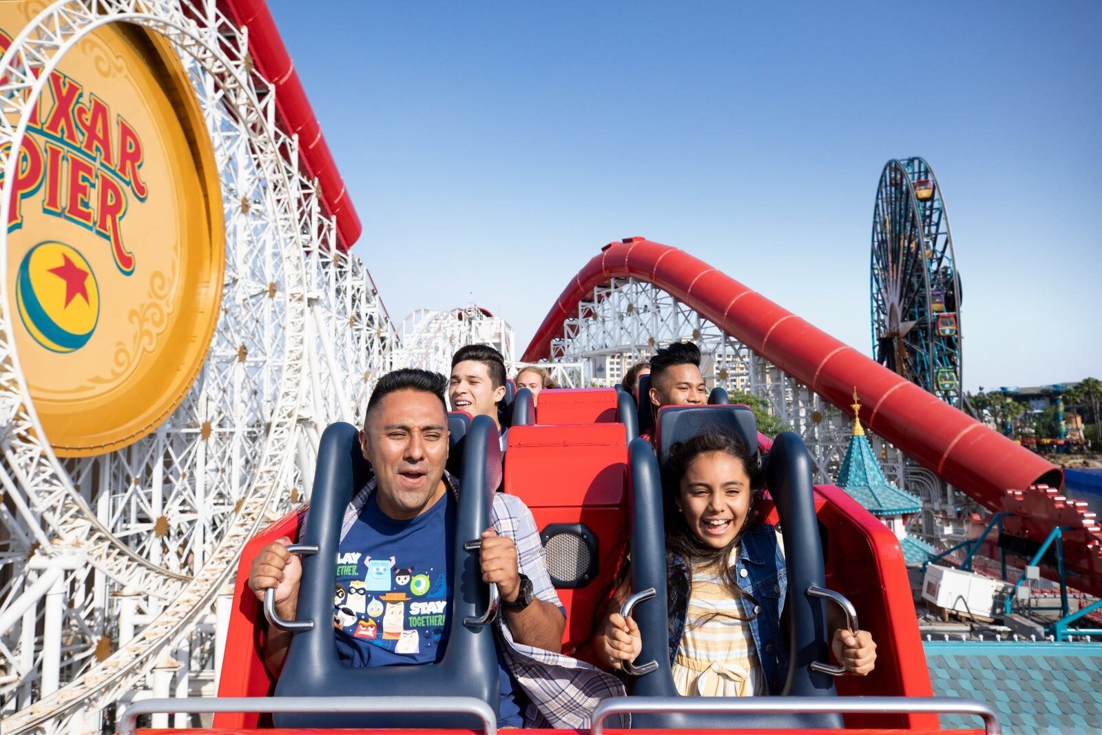 Guests riding the Incredicoaster at Pixar Pier Guests riding the Incredicoaster at Pixar Pier