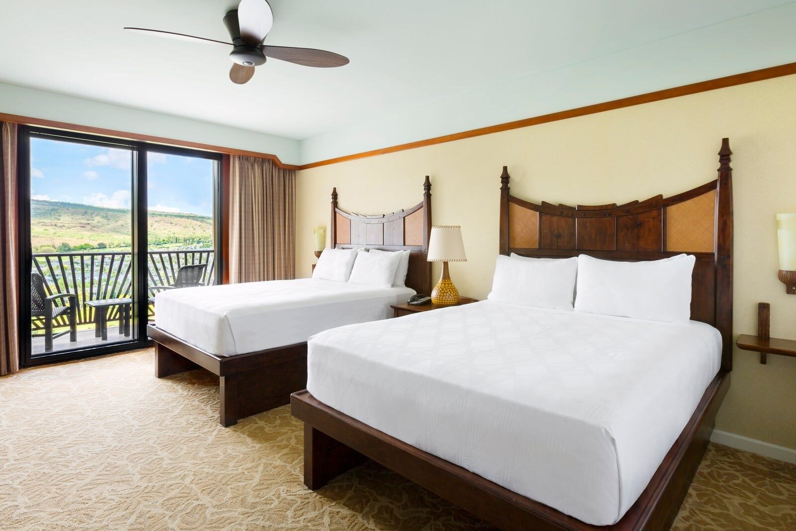 An Aulani room with island garden view, two queen beds and a balcony An Aulani room with island garden view, two queen beds and a balcony