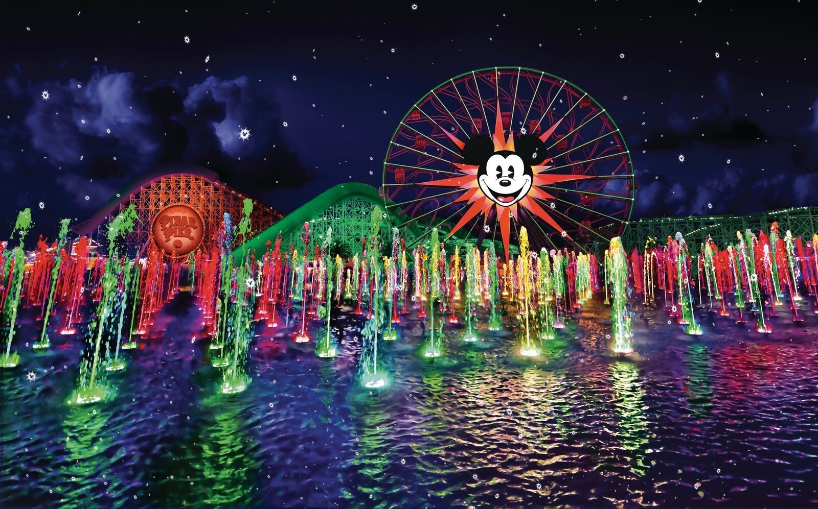 Le spectacle World of Color dans sa version des Fêtes, jets d'eau colorés devant la grande roue Le spectacle World of Color dans sa version des Fêtes, jets d'eau colorés devant la grande roue